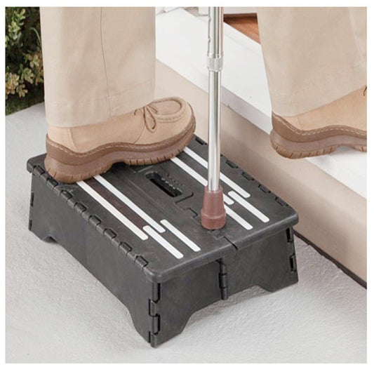 person with one foot and cane on top of the stepping stool. Other foot entering a doorway