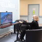 woman using 2RaceWithMe in armchair